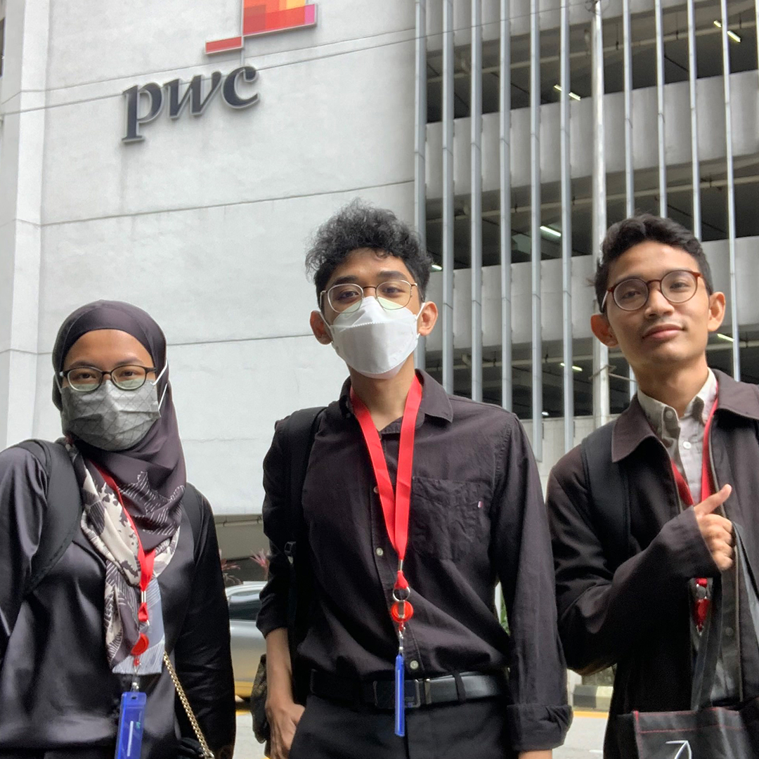 Photo of Alif and Colleague in front of PwC Building